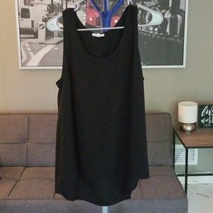 Flowy work top. Long in back,  shorter in front.